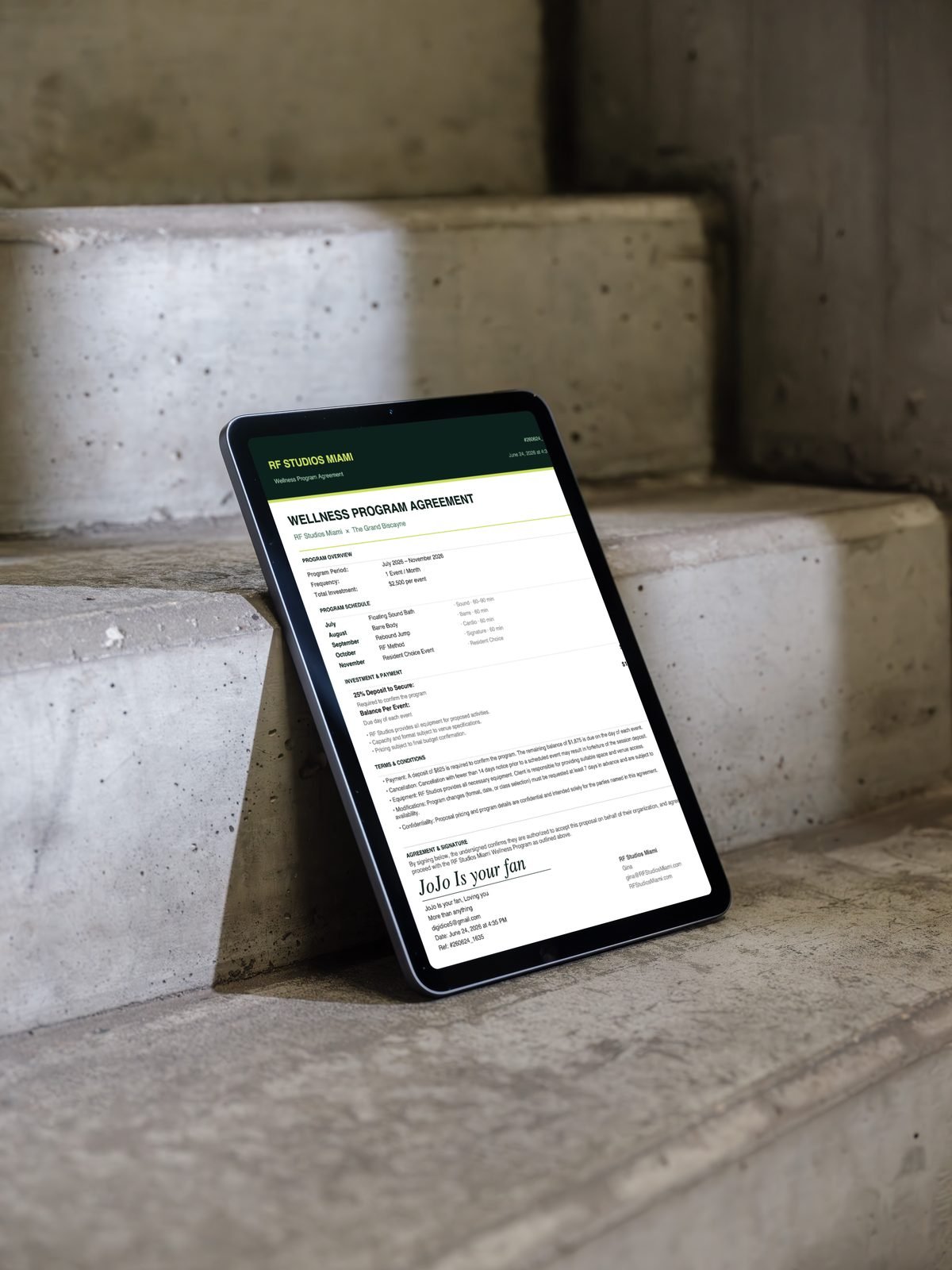 RF Studios signed wellness program agreement PDF on iPad Air