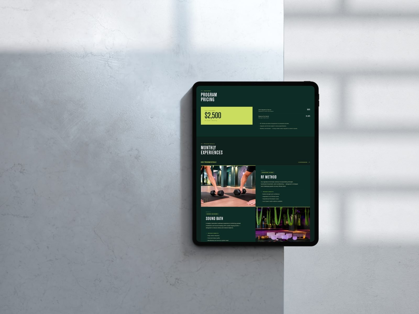RF Studios proposal — program pricing and monthly experiences on iPad Pro, marble surface